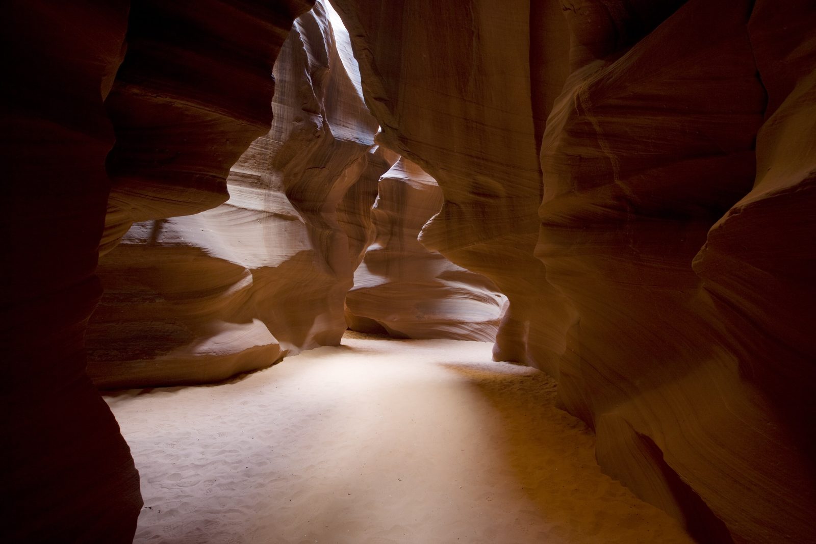 A shaft of light on the sand floor of Antelope Canyon, Page, Arizona